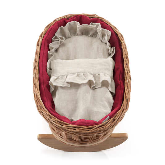 wicker cradle for dolls with red piping, with pillow and quilt