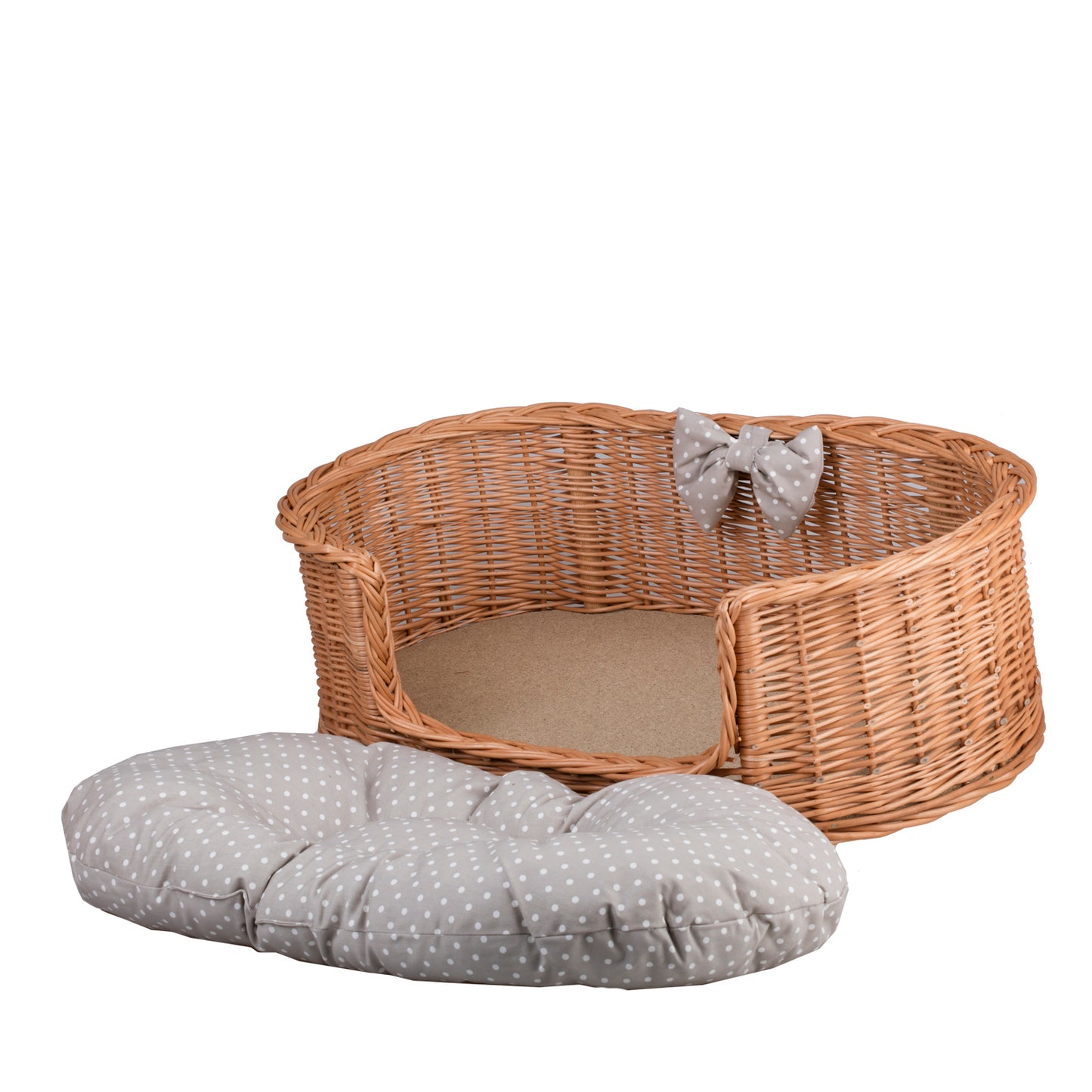Esoria wicker pet bed for dogs and cats with a beige cushion, elevated on legs with a low entry TheWickerStories