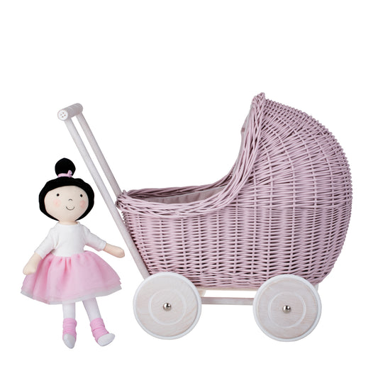 wicker doll pram with pink trim, quilt and pillow