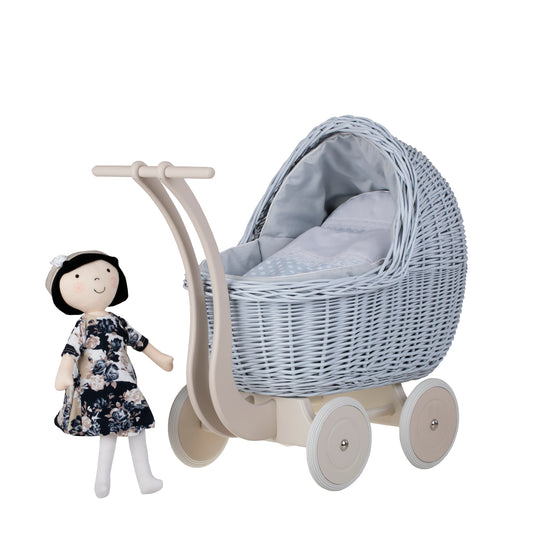 wicker doll stroller with blue trim, blanket, and pillow