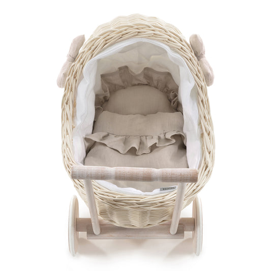 wicker doll stroller with white trim, blanket, and pillow, with handle