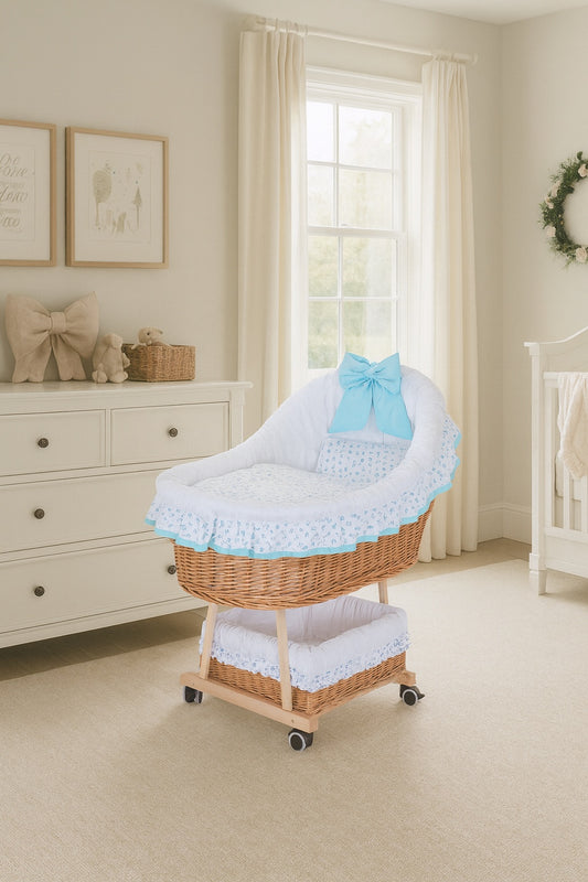 Papilio wicker baby stroller with white trim and blue accents, featuring a canopy, quilt, and pillow, on wheels with a brake TheWickerStories