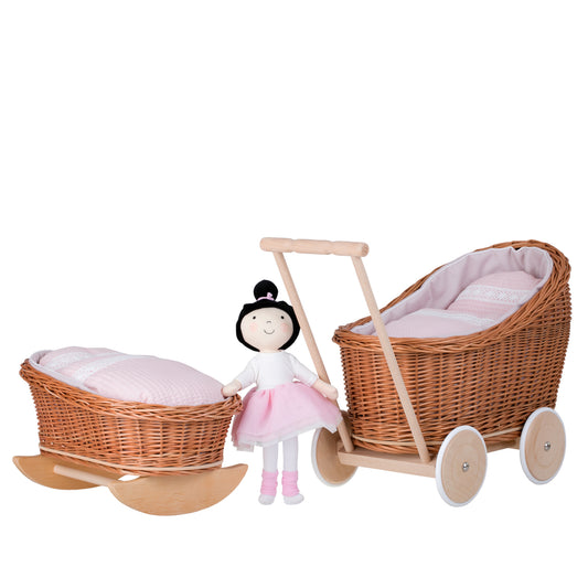 wicker doll stroller and cradle with pink trim, blanket, and pillow