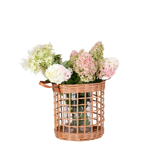 Neloria wicker storage basket for towels and toys, with leather handles TheWickerStories