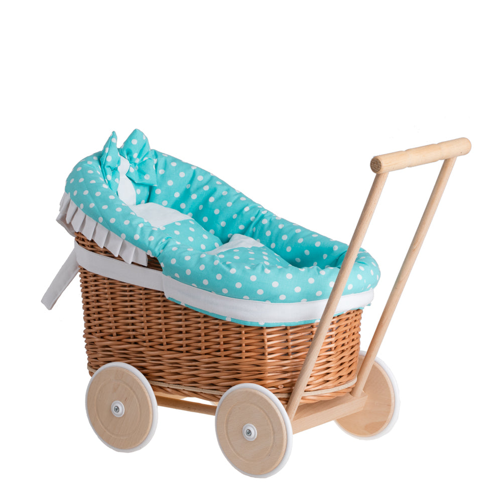 Luna wicker doll stroller with green trim, blanket, and pillow