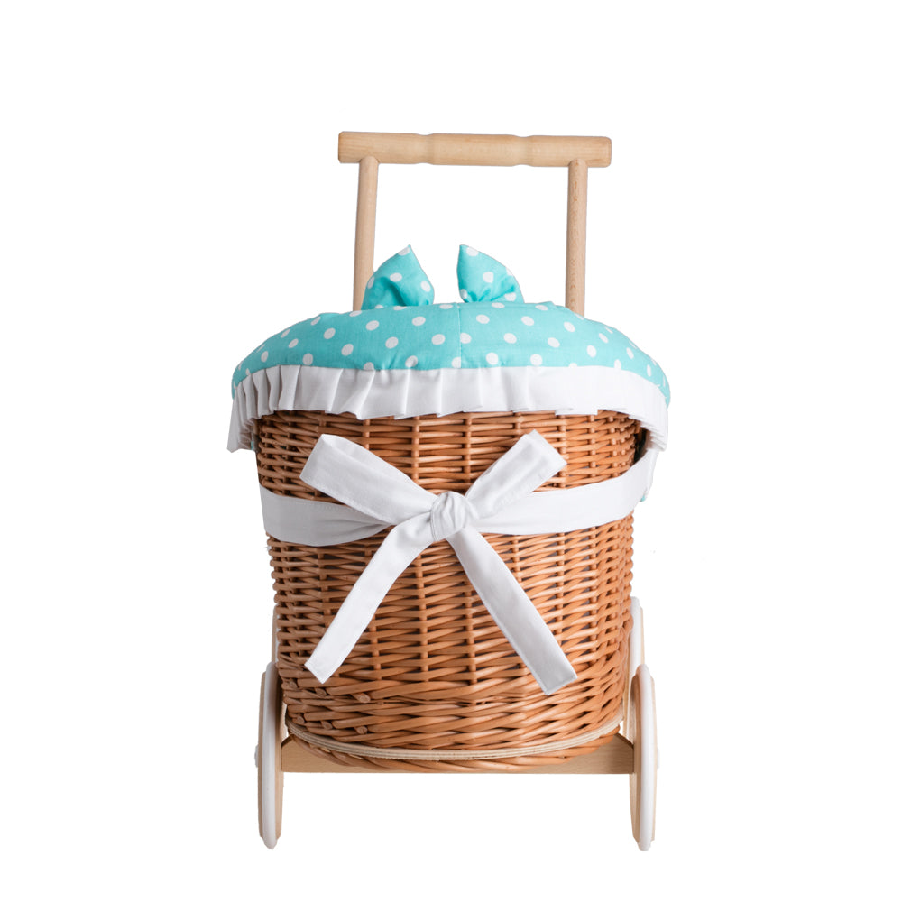 Luna wicker doll stroller with green trim, blanket, and pillow