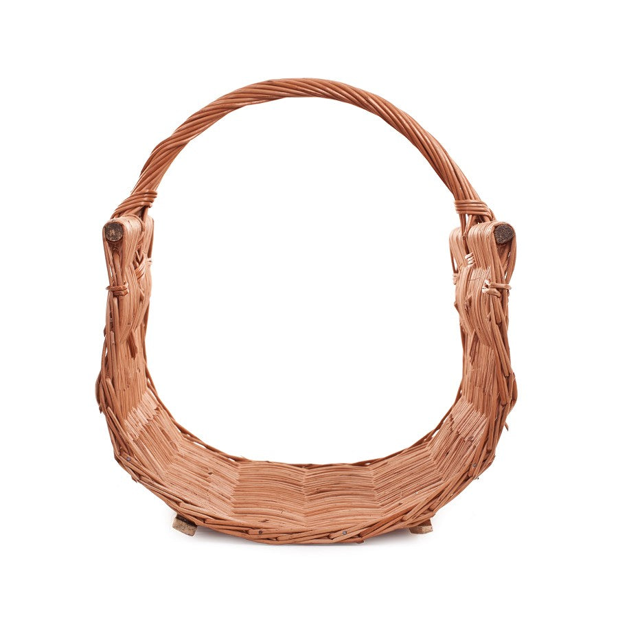 Fano wicker firewood basket with handle on wooden runners TheWickerStories