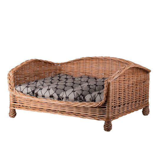 wicker pet bed for dog and cat with beige cushion and lowered entrance