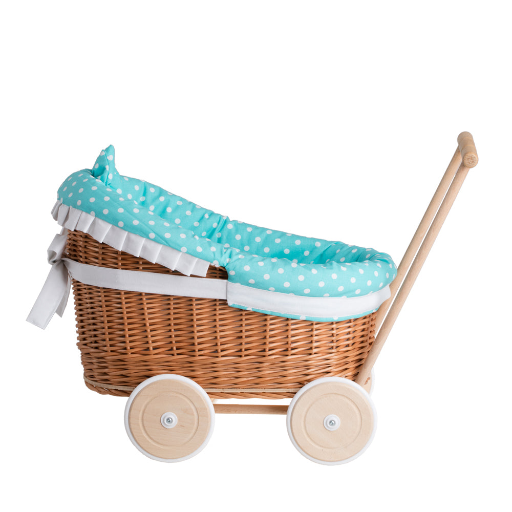 Luna wicker doll stroller with green trim, blanket, and pillow
