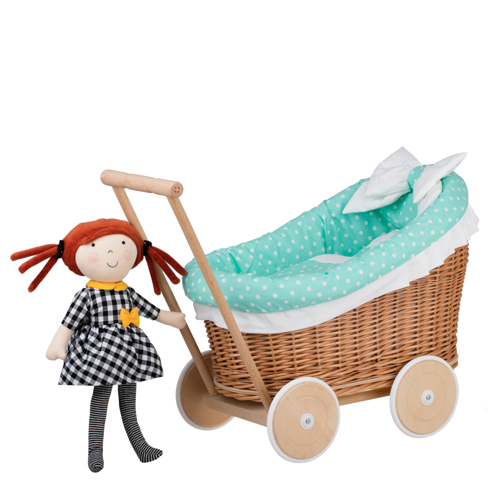 Luna wicker doll stroller with green trim, blanket, and pillow