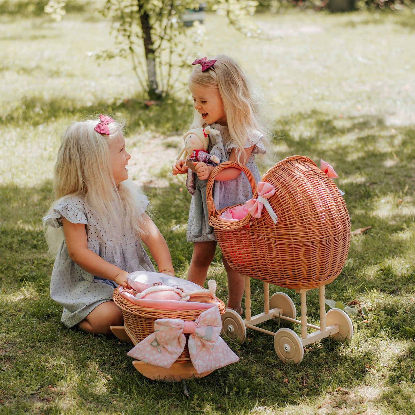 Lili wicker stroller and cradle for dolls with pink trim, blanket, and pillow