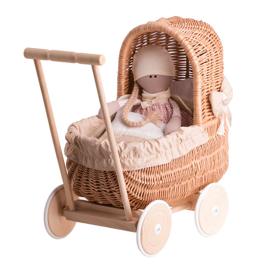 wicker doll stroller with beige trim, blanket and pillow