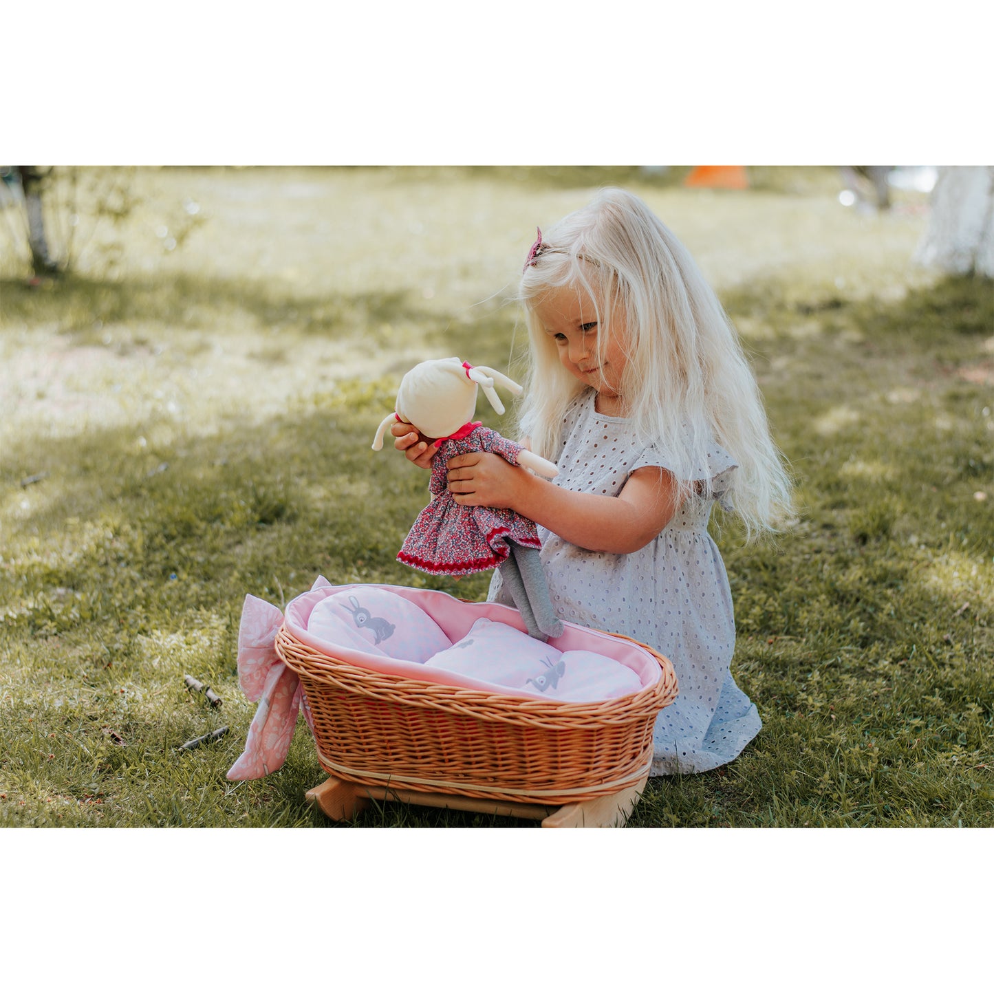 Lili wicker stroller and cradle for dolls with pink trim, blanket, and pillow