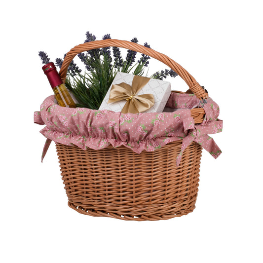 Magnus wicker bike basket with pink trim, featuring a handle and handlebar straps TheWickerStories