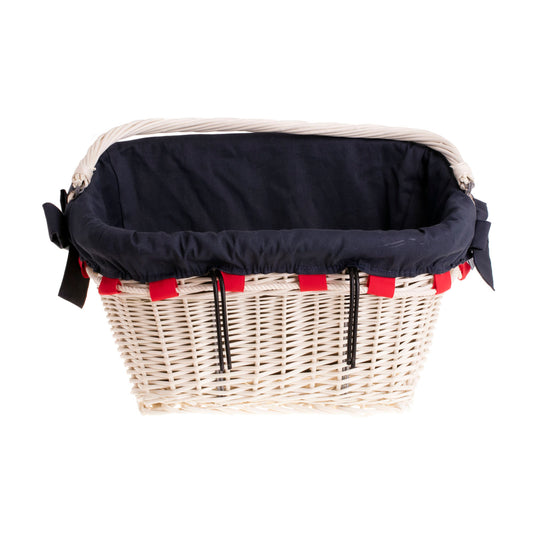 Magnus wicker bike basket with navy trim, with a handle and bows TheWickerStories