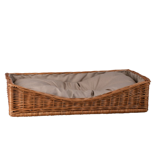 wicker basket for dog and cat with beige trim and cushion
