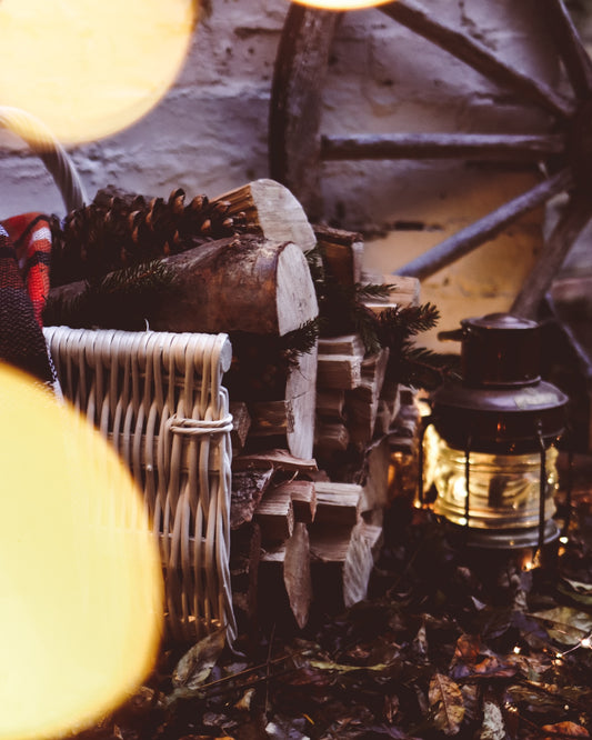 wicker firewood basket with jute trim and handle