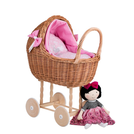 Lili wicker doll stroller with pink trim, blanket, and pillow