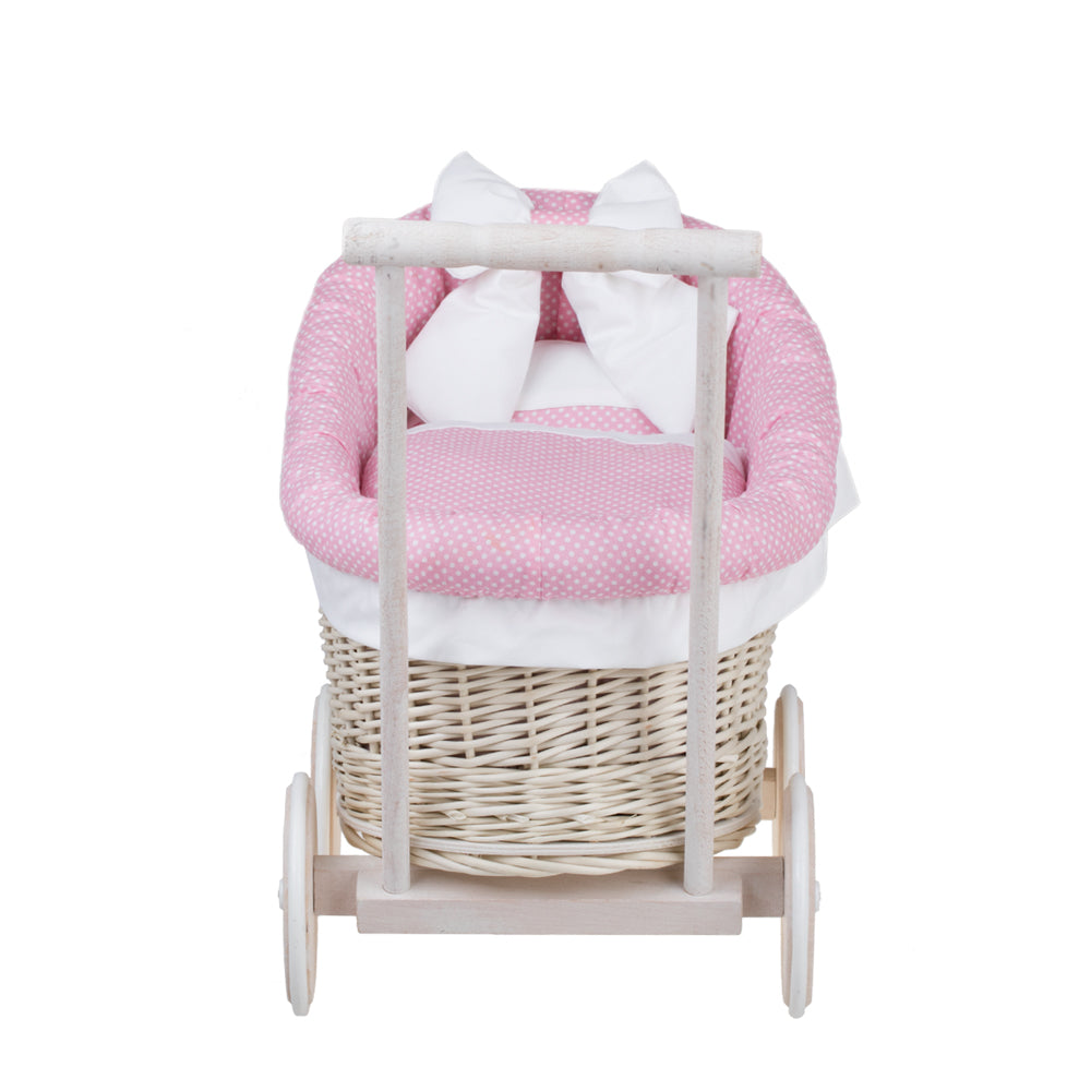 wicker doll stroller with pink trim, blanket and pillow