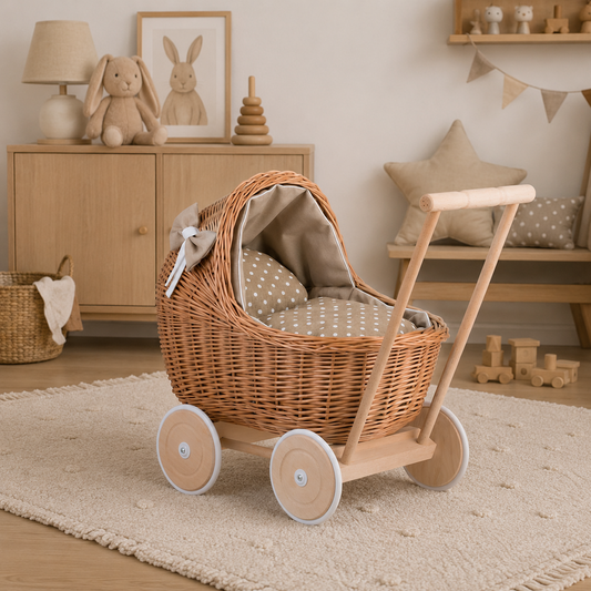 wicker doll stroller with beige trim, blanket, and pillow