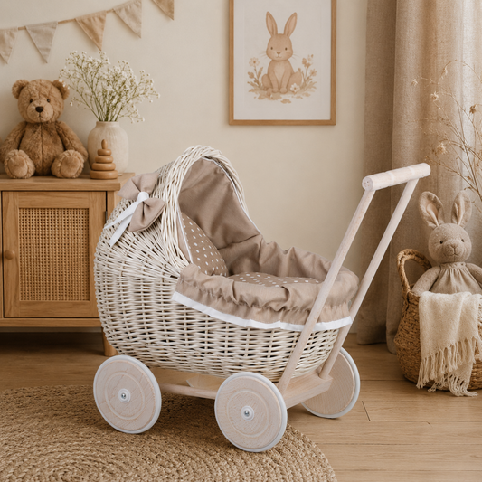 wicker doll stroller with beige trim, blanket, and pillow