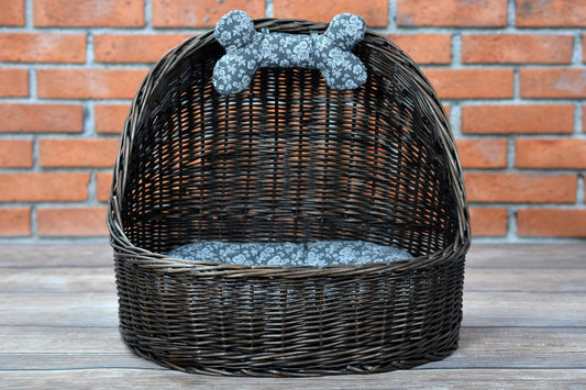 Elsa wicker basket pet bed with gray cushion and bone