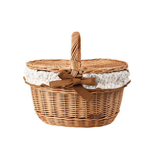 wicker picnic basket with brown trim, with lid and handle