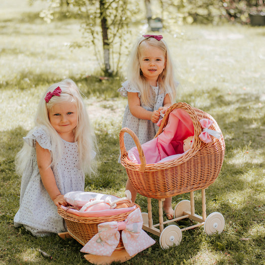 Lili wicker stroller and cradle for dolls with pink trim, blanket, and pillow