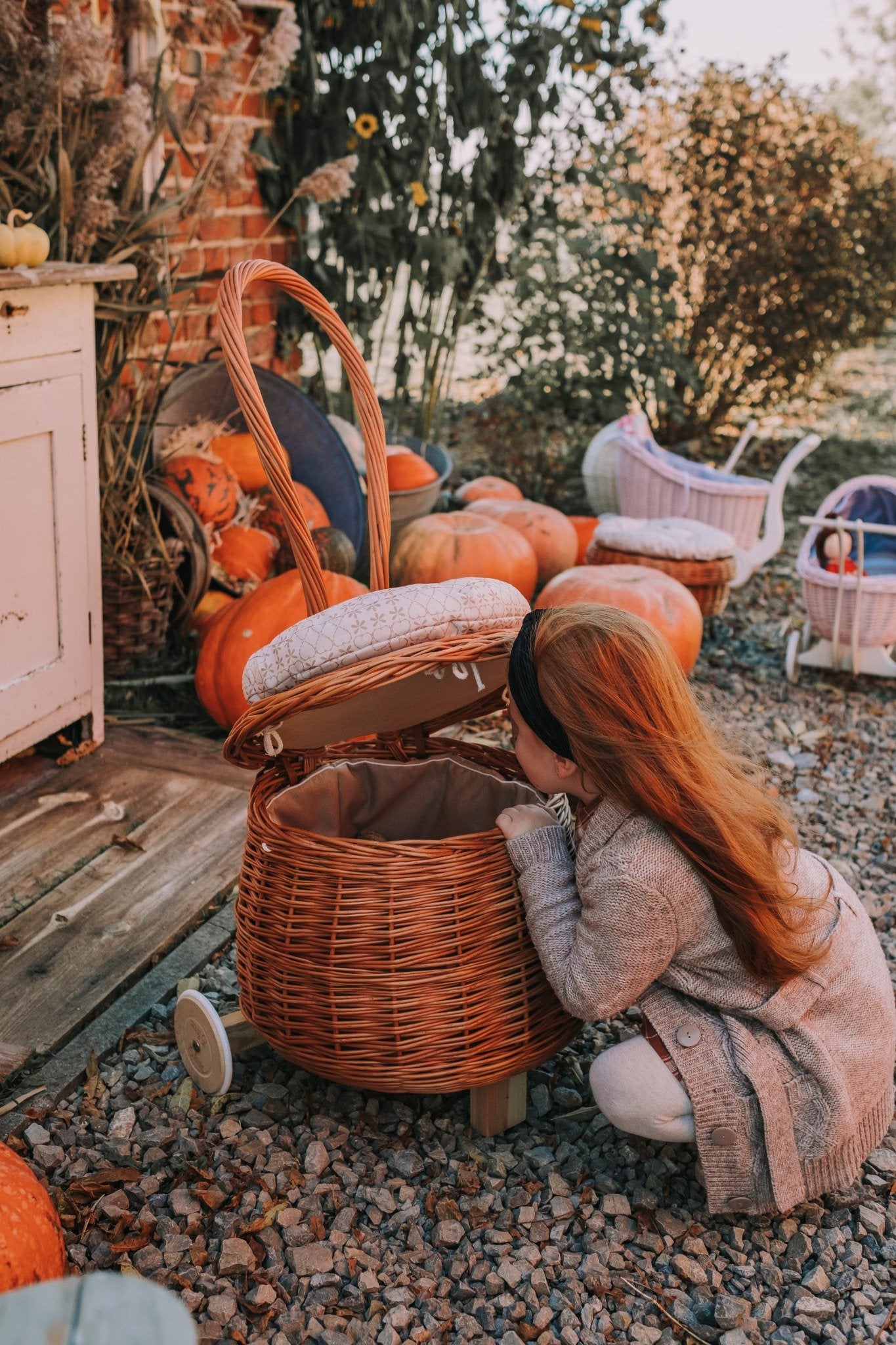 Salix wicker storage pouf with beige trim, cushion and caster wheels TheWickerStories