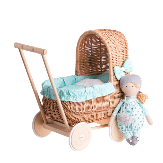 Lala wicker doll stroller with green trim, blanket, and pillow