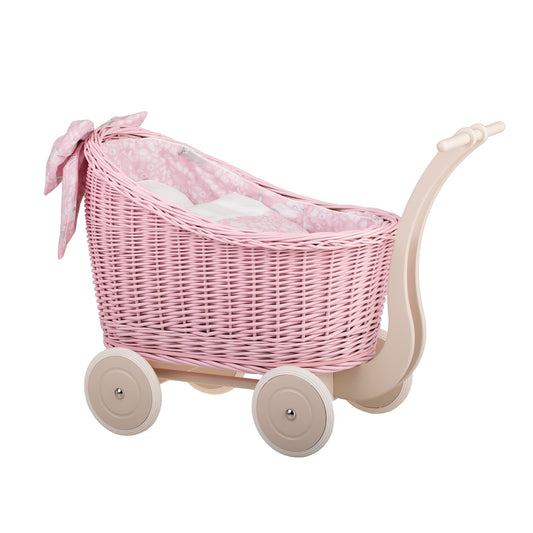 Luna wicker doll stroller with pink trim, blanket, and pillow